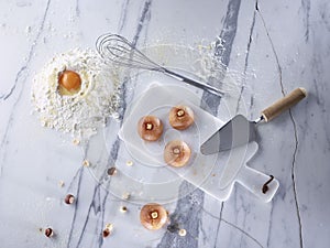 Traditional Turkish dessert preparation on marble background