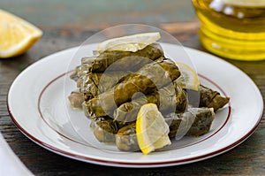 Stuffed grape leaves with rice,olive oil and herbs in white plate