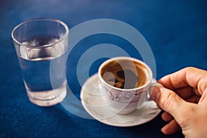 Traditional turkish drink of coffee on blue table