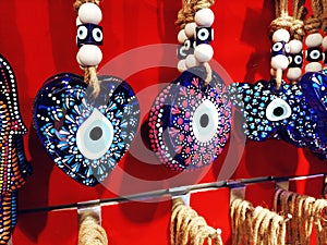 Traditional turkish evil eye charm lockets at a shop photo