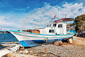 Traditional Turkish fishing boat ashore for maintenance