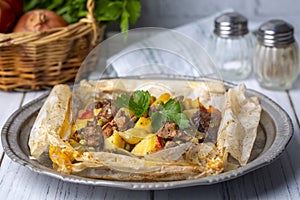 Traditional Turkish food; Meat with vegetables wrapped in greaseproof paper, kebab Turkish name; Sebzeli kagit kebabi