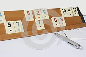 Traditional Turkish game okey, plastic chips with numbers on a wooden stand