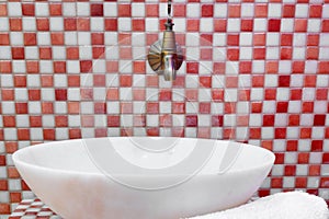 Traditional Turkish hamam with stone walls, sink