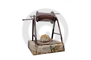 Traditional Turkish iron water well with pulley isolated on white background, Abandoned and closed with a rock