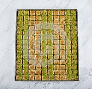 Traditional Turkish Pastry Dessert pistachio Baklava. Baklava shop. Turkish pistachio and yufka dessert, pistachio baklava on a