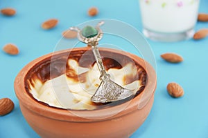 Traditional Turkish sweet supangle dish, a glass of airan and almonds photo