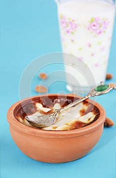 Traditional Turkish sweet supangle dish, a glass of airan and almonds photo