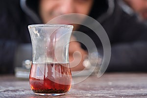 Traditional turkish tea inside traditional slim waisted glass cup