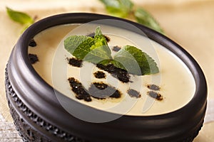 Traditional Turkish Yayla soup with mint and yogurt close up in