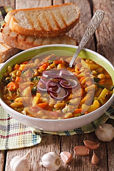 Traditional Tuscan ribollita vegetable soup close up in a bowl.