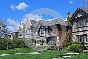 traditional two story houses and front lawns photo