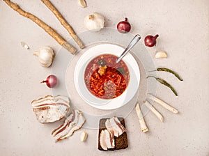 Traditional Ukrainian borsch, made from red beets, cabbage, and meat. A plate of Ukrainian folk dish, with Ukrainian