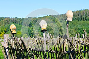 Traditional ukrainian clay pots on wicker fence