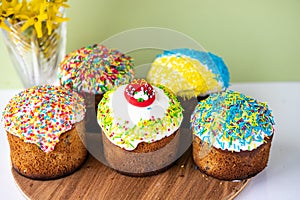 Traditional Ukrainian Easter Cake Kulich. Orthodox Christian Easter Bread or Easter Cake with frosting, Easter Eggs and