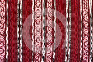 Traditional Ukrainian embroidery pattern in black red and white colors on textile