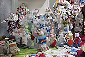 Ukrainian folk amulet dolls `motankas` of knotted straw and fabric photo