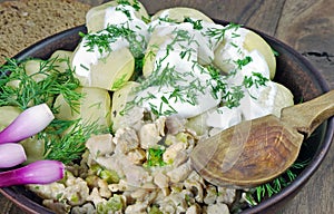 Traditional Ukrainian Poltava dumplings with meat and sour cream. close up.