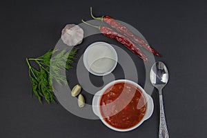 Traditional Ukrainian Russian borsch with white sour cream. Plate of borscht red beetroot soup on a table. Borsch on top.