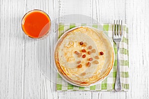 Traditional Ukrainian or Russian pancakes on a white table. The