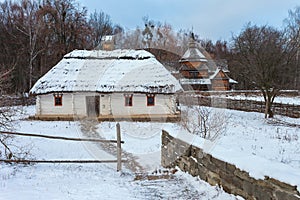 Traditional Ukrainian village in winter. Old house at Pirogovo ethnographic museum,