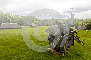 Traditional ukrainian wooden windmill in the fog.