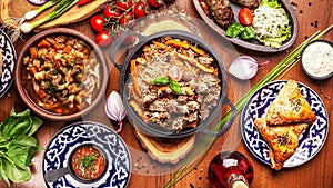 Traditional Uzbek oriental cuisine. Uzbek family table from diff