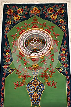 Traditional Uzbek pattern on the ceramic tile on the wall of the mosque. Islamic mosaics pattern or abstract background