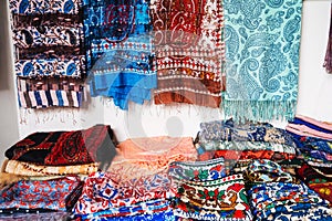 Traditional Uzbek scarves with bright colorful pattern at the oriental bazaar in Tashkent in Uzbekistan