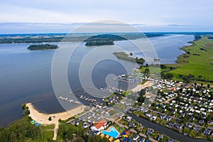 Traditional vacation in Holland. Drone photography with a view of the campsite on the banks of the Veluwe Sea.