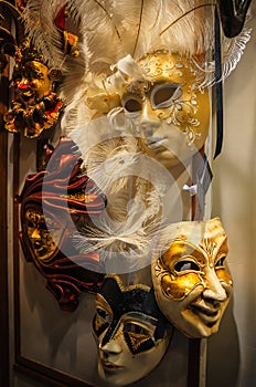 Traditional Venetian masks for carnival in showcase street shop.