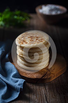 Traditional Venezuelan food arepa made from cornmeal, rustic style