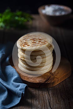 Traditional Venezuelan food arepa made from cornmeal, rustic style photo