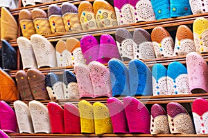 Traditional vibrant Moroccan slippers - `babouches` on the market in Fez, Morocco