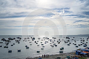 Traditional Vietnamese boat in the basket shaped on fishing port at Fishing village in sunset sky , Binh Thuan, Vietnam. Landscape