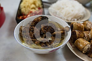 Traditional Vietnamese Bun Cha meal with soup, meat and fried springrolls