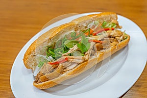 Traditional Vietnamese chicken meat sandwich and scallion- Banh Mi