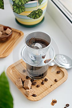 Traditional Vietnamese coffee and aluminium filter, coffe shop concept, morning routine