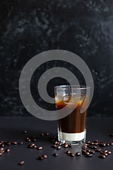 Traditional vietnamese iced coffee with condensed milk and coffee beans