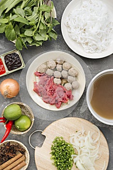 Traditional vietnamese noodle soups pho in bowls, concrete background. Vietnamese beef soup pho bo, Close-up. Asian/vietnamese