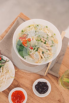 Traditional vietnamese noodle soups pho in bowls, concrete background. Vietnamese beef soup pho bo, Close-up. Asian/vietnamese