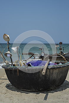 Traditional Vietnamese round fishing boats on the beach.