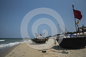 Traditional Vietnamese round fishing boats on the beach.