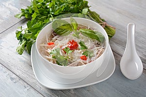 Traditional Vietnamese soup Pho bo with herbs,beef, rice noodles,chili and  bean sprouts