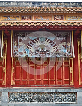 Traditional vietnamese tempel wall with colorful paintings in Hue imperial city, Vietnam.