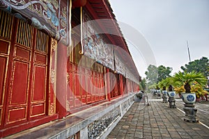 Traditional vietnamese tempel wall with colorful paintings in Hue imperial city, Vietnam.