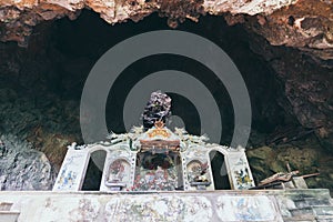 Traditional Vietnamese temple inside the rock cave in Ninh Binh province, Vietnam