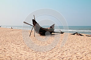 Traditional Vietnamese wooden fishing boat at the beach at