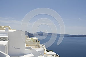 Traditional view of houses above the sea in Oia, Santorini, Greece.