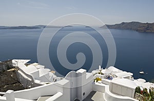 Traditional view of houses above the sea in Oia, Santorini, Greece.